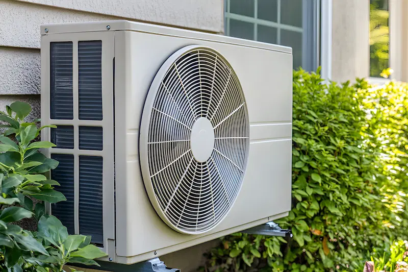 Air-source heat pump outside a home